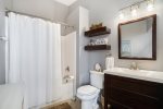 Perfect for Unwinding After a Day Out in SoHa, The Bathroom at The Shoreline Vibe Offers a Serene Ambiance